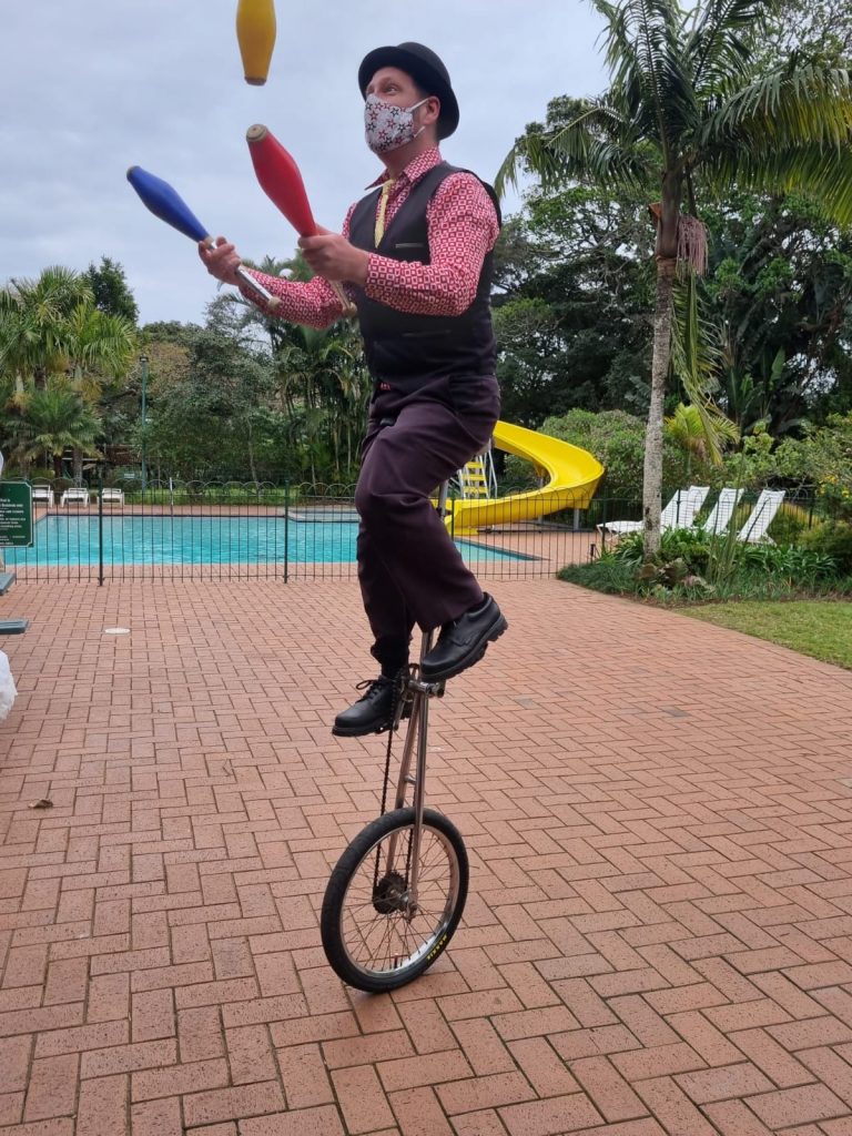 Tom Jugging on a giraffe unicycle