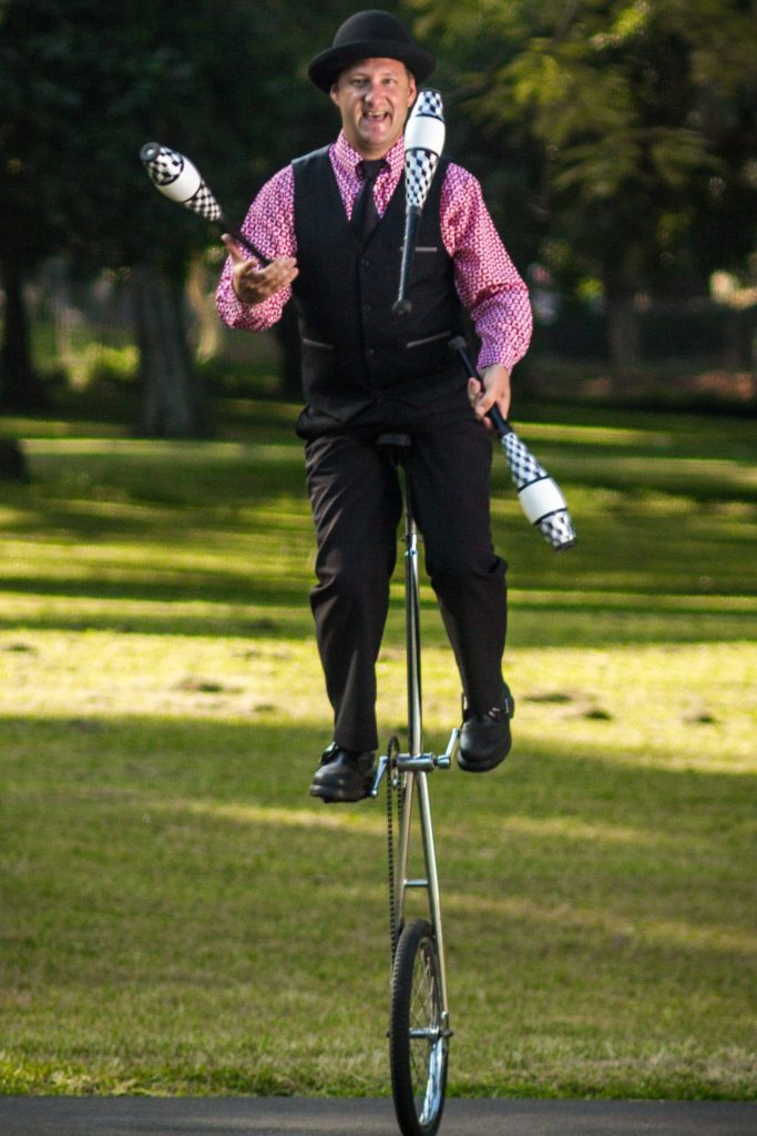 Juggling on a giraffe unicycle